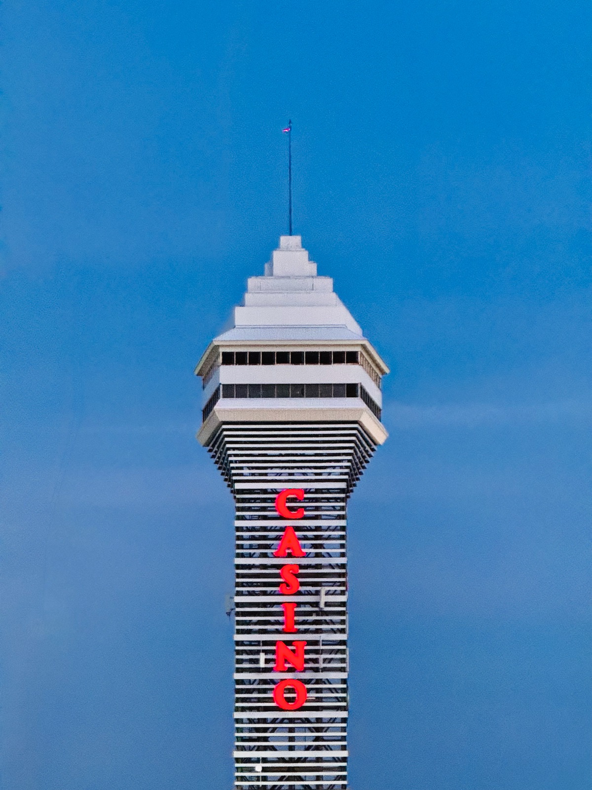 A tall observation tower against a blue evening sky