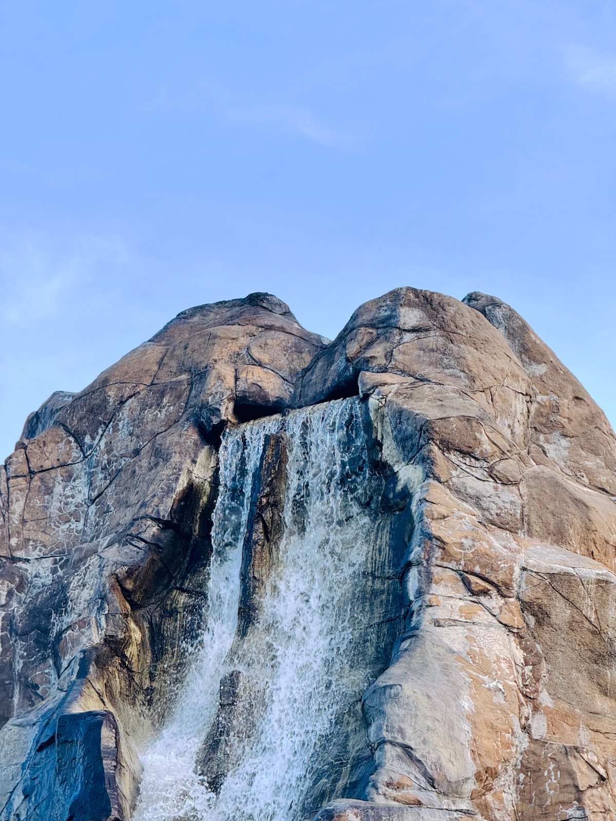 A waterfall running down a rocky peak